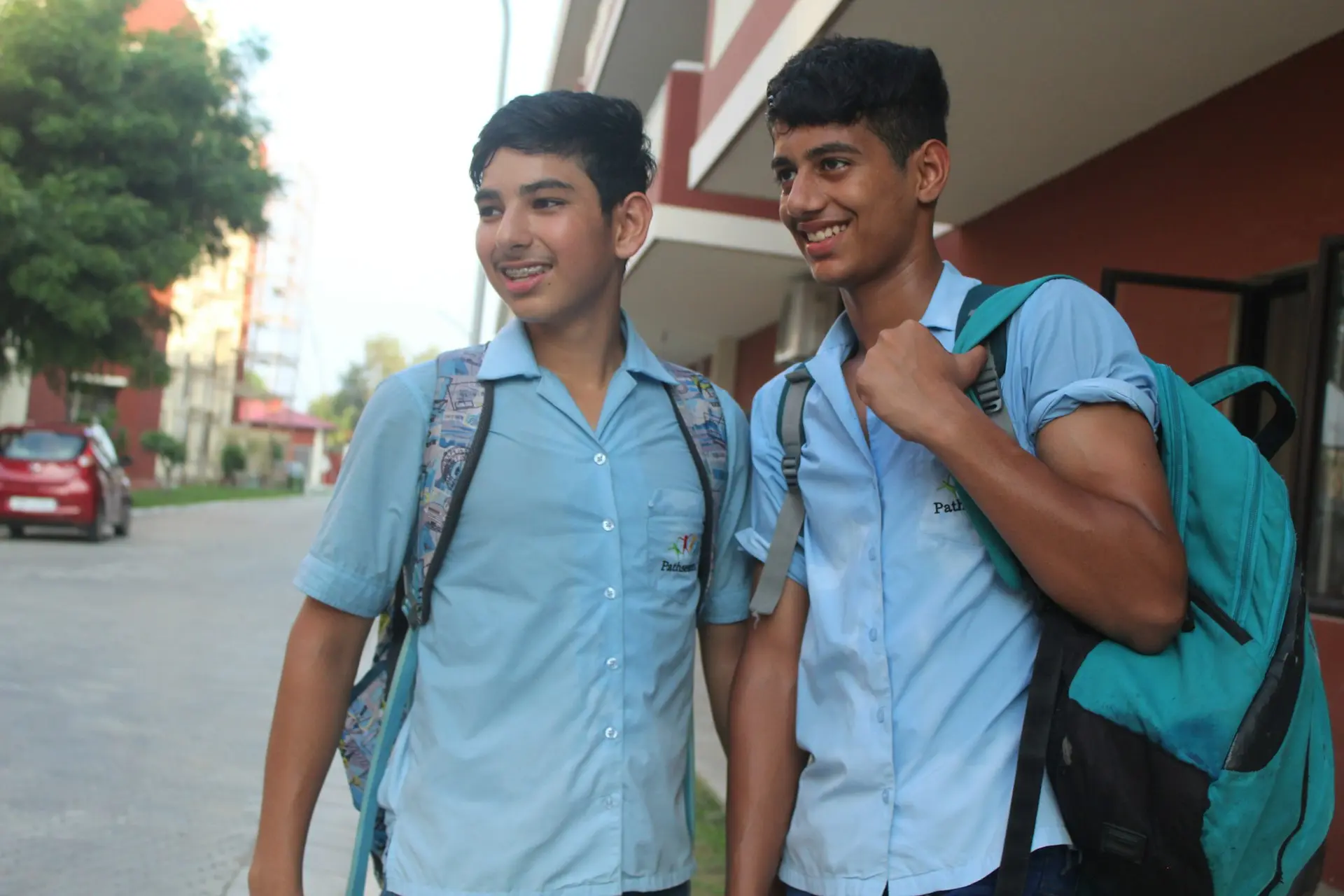 a couple of young men smiling
